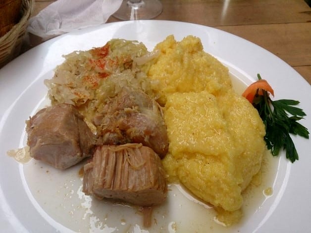 The yellow stuff is the Romanian 'Polenta' - mashed corn with cream. I didn't like it at all but many do.